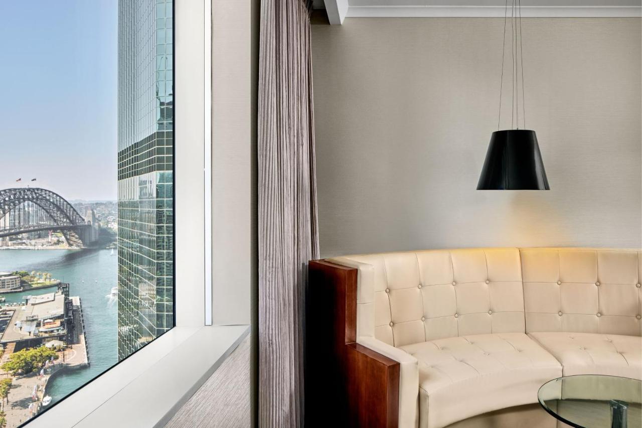 Sydney Harbour Marriott Hotel At Circular Quay Exterior photo A view of the Sydney Harbour Bridge from a suite at the hotel